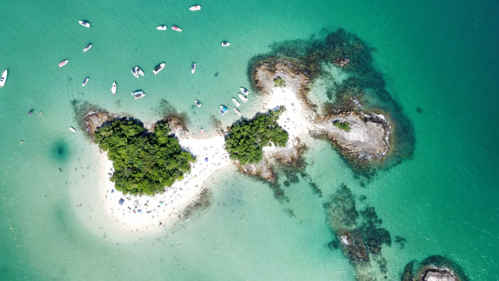 Paradisiacal view of Angra dos Reis with blue sea, green islands, and boats in the background