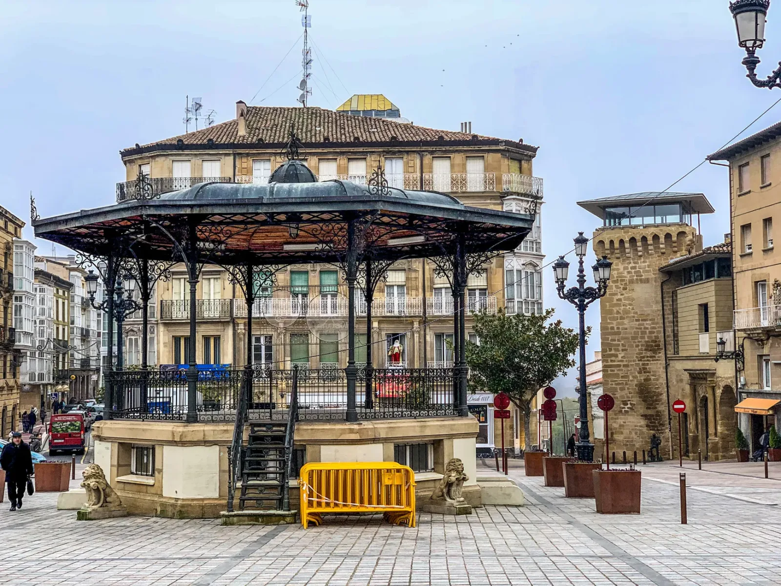 Coastal view of Gijón with the historic district, the beach, and the sea in the background
