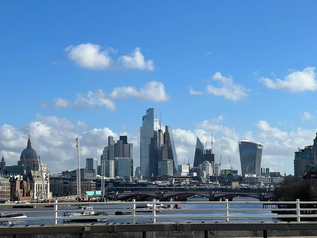 Streets of London under a cloudy sky and light rain, with a typical November or March atmosphere.
