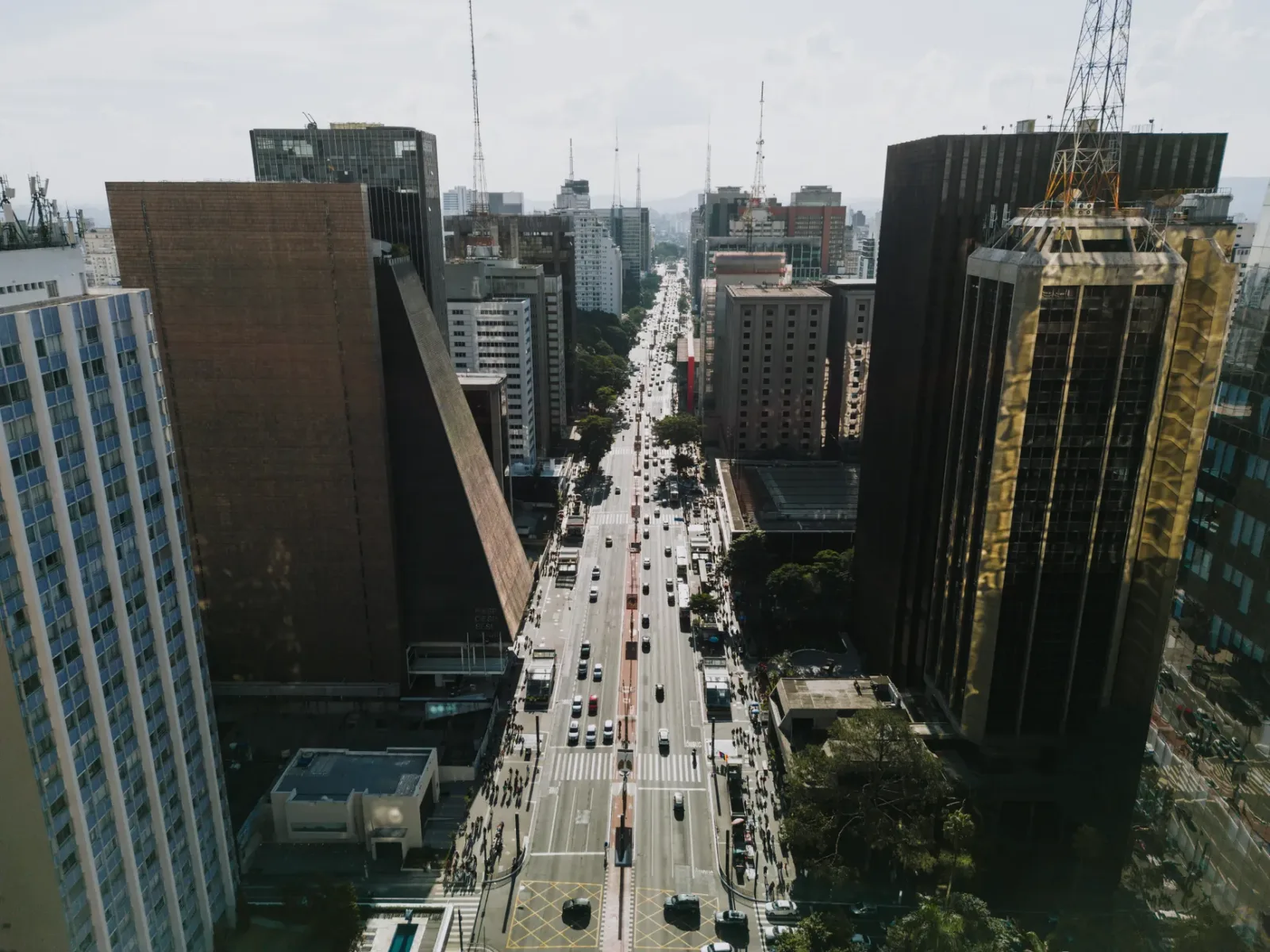 Aerial view of skyscrapers and busy avenues in downtown São Paulo.