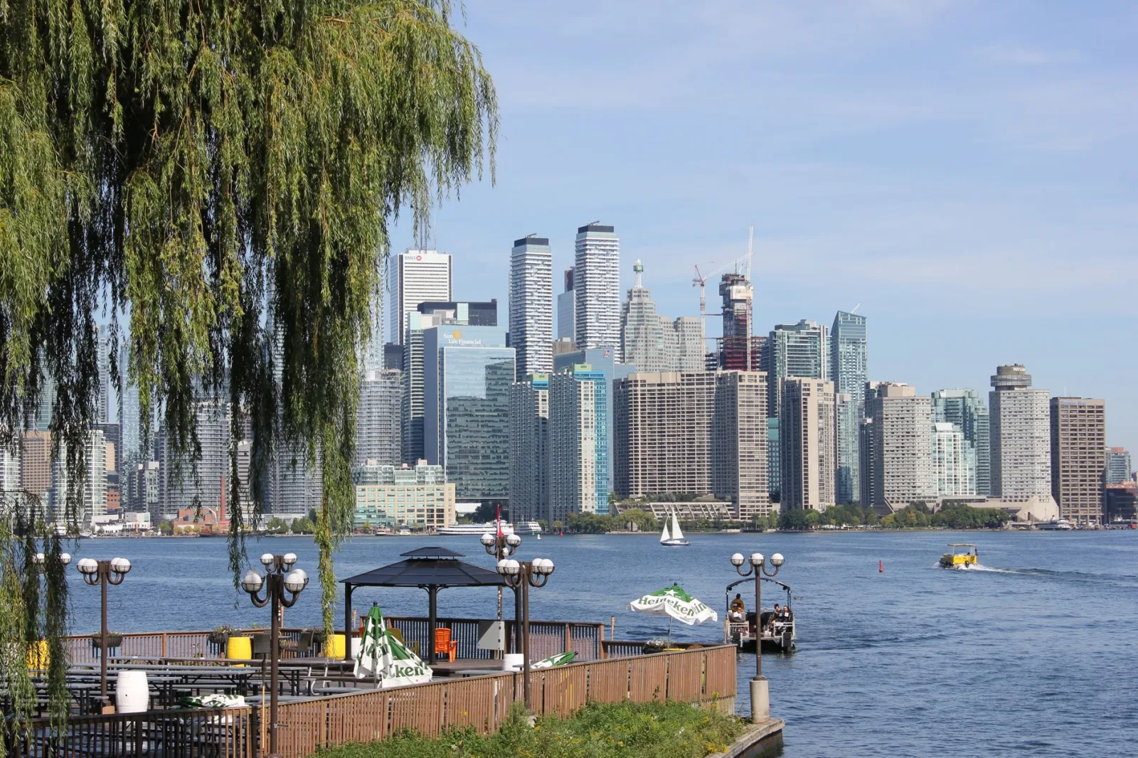 Toronto skyline with the lake in the background and modern buildings on the waterfront.