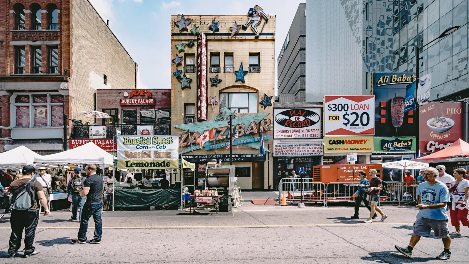 Vibrant street in Toronto with urban facades and a walkable atmosphere.