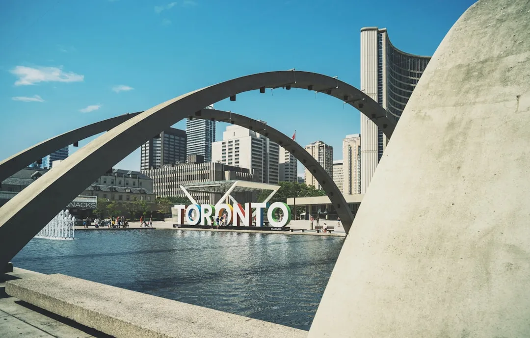 Toronto skyline with the CN Tower in the background over the harbor.