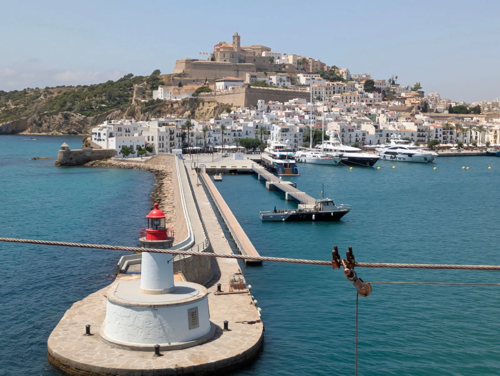 Panoramic view of the blue sea and sunny coast of Ibiza.