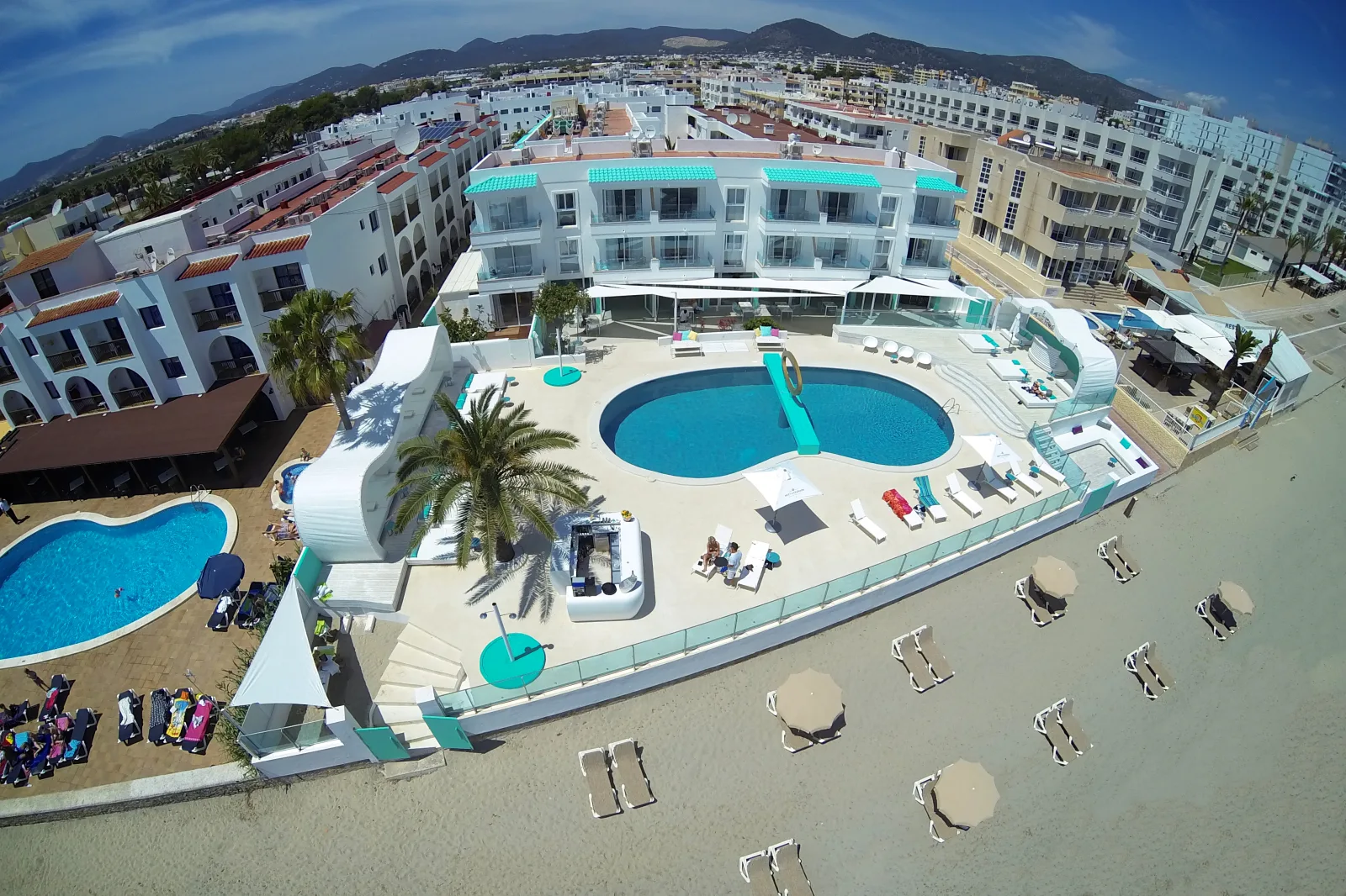 Coastal view of Ibiza with hotels and sea, suggesting a strategic area to stay