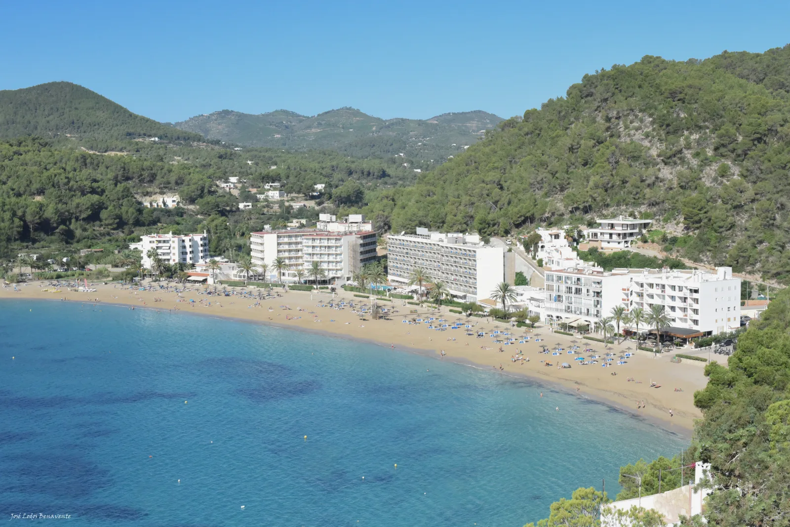 Seaside beach club in Ibiza, with outdoor tables and a relaxed sunset atmosphere
