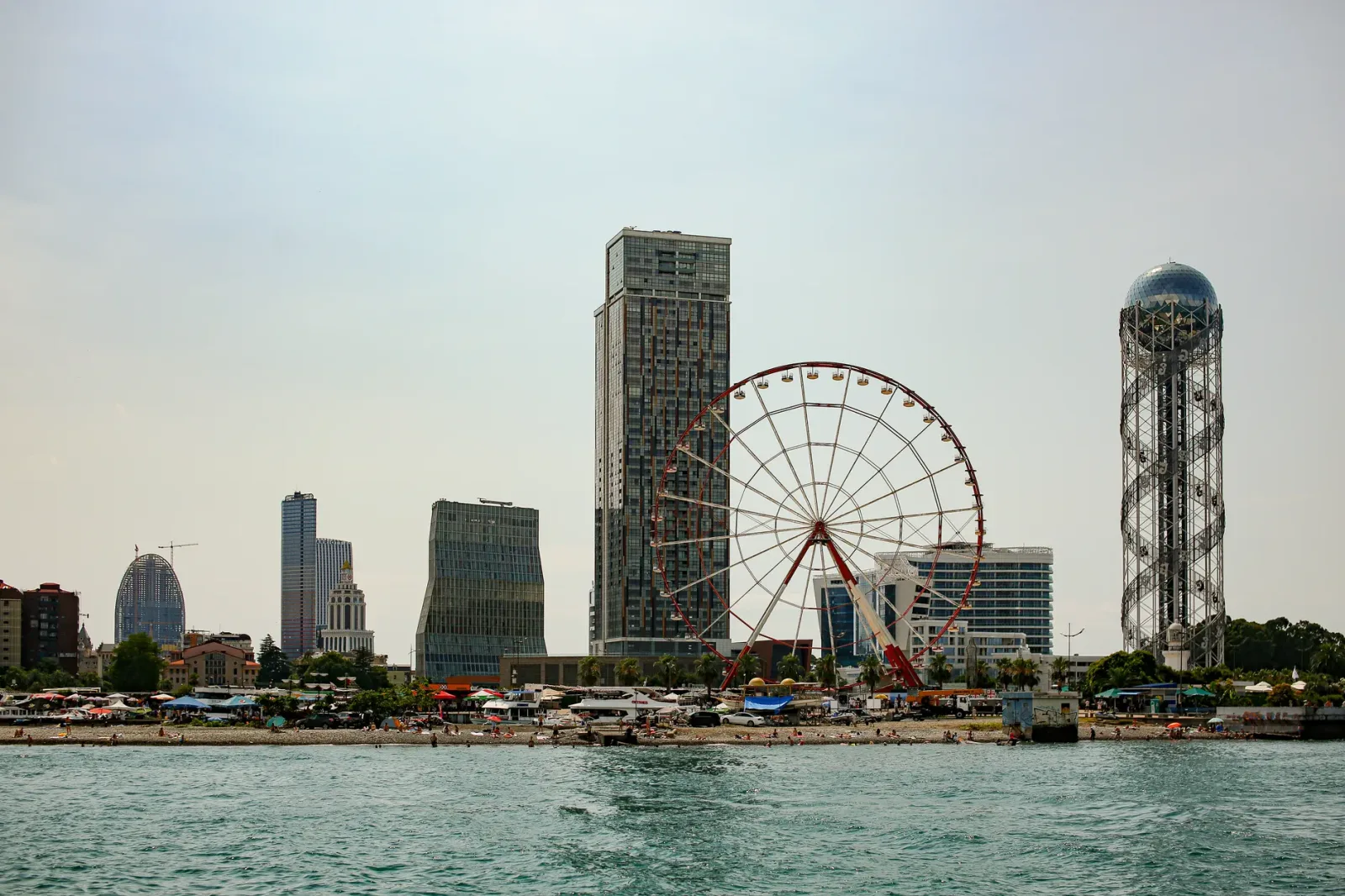Urban view of Batumi with modern buildings and the sea in the background.