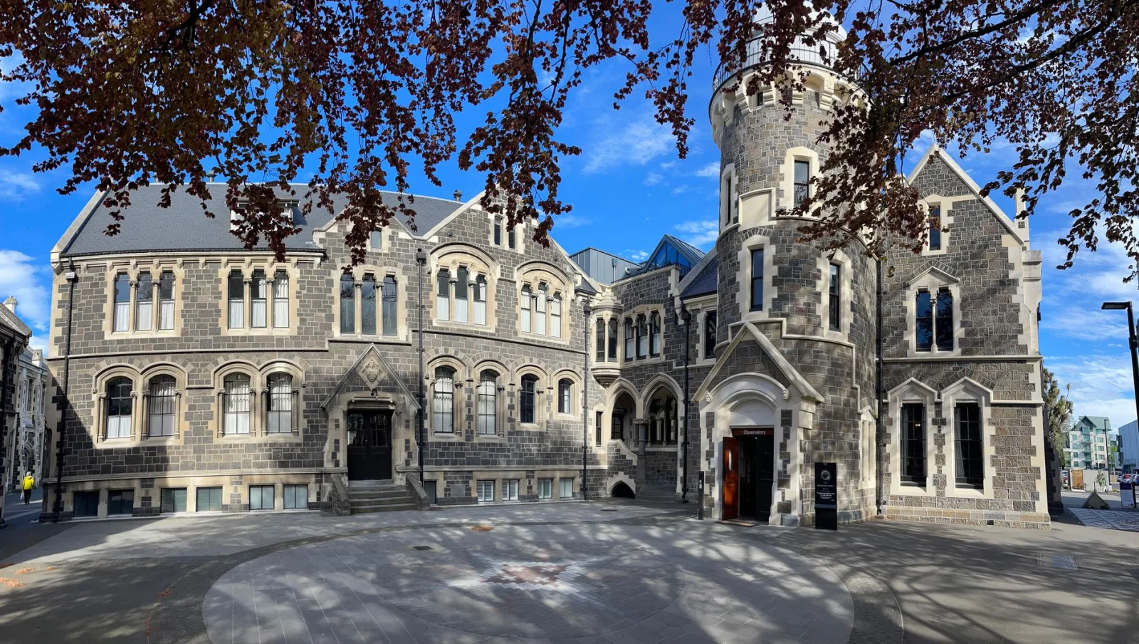 Urban view of Christchurch with tree-lined streets and low-rise buildings in the background