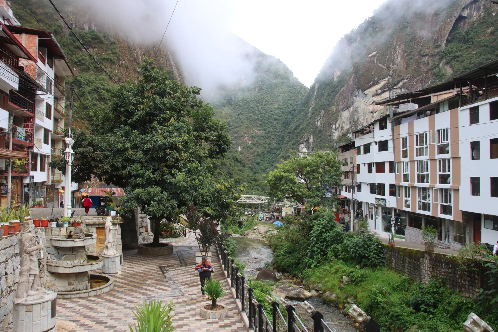Village of Aguas Calientes among mountains, on the banks of the Vilcanota River, gateway to Machu Picchu.