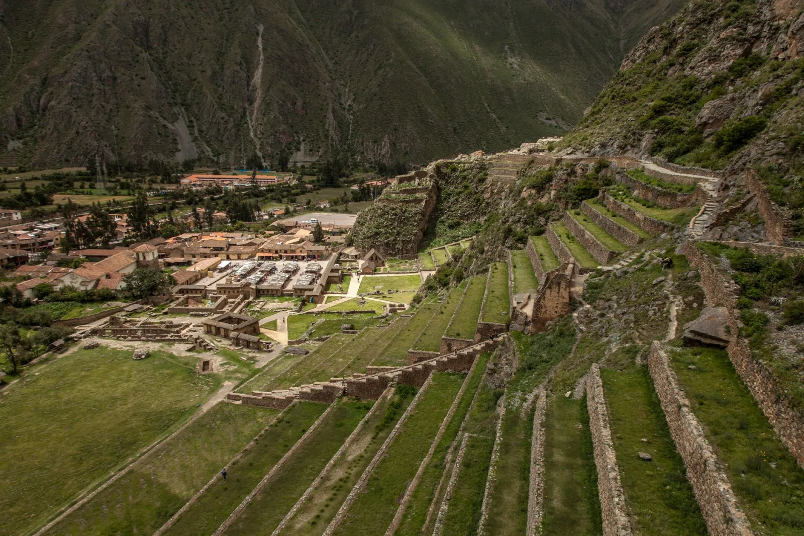 Inca ruins of Ollantaytambo with mountains in the background in the Sacred Valley